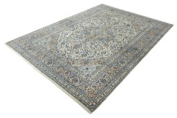 Corner detail of 2000s Kashan rug showing border pattern and Wool pile