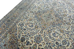Backside of handmade 2000s Kashan rug showing knot structure and weave density