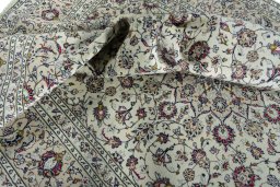 Surface texture of 2000s Kashan rug with natural Wool and intricate pattern