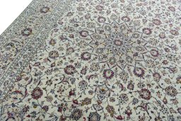 Backside of handmade 2000s Kashan rug showing knot structure and weave density