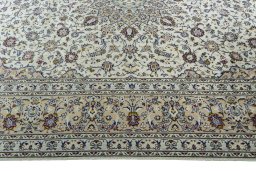 Corner detail of 2000s Kashan rug showing border pattern and Wool pile