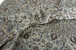 Surface texture of 2000s Kashan rug with natural Wool and intricate pattern