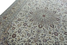 Backside of handmade 2000s Kashan rug showing knot structure and weave density