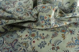 Surface texture of 2000s Kashan rug with natural Wool and intricate pattern
