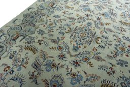 Backside of handmade 2000s Kashan rug showing knot structure and weave density