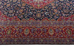 Corner detail of 2000s Kashan rug showing border pattern and Wool pile