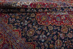 Close-up detail of 2000s Kashan rug from Iran / Persia showing Wool weave