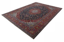 Corner detail of 2000s Kashan rug showing border pattern and Wool pile