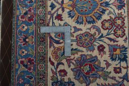 Backside of handmade 1930s Kashan rug showing knot structure and weave density