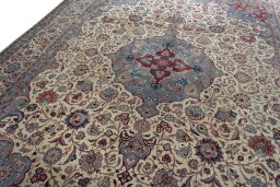 Backside of handmade 1930s Kashan rug showing knot structure and weave density