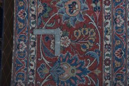 Backside of handmade 1930s Kashan rug showing knot structure and weave density