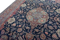 Backside of handmade 1930s Kashan rug showing knot structure and weave density
