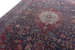 Backside of handmade 1930s Kashan rug showing knot structure and weave density