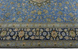 Corner detail of 2000s Kashan rug showing border pattern and Wool pile