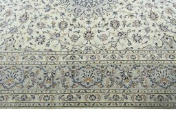 Corner detail of 2000s Kashan rug showing border pattern and Wool pile