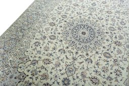 Backside of handmade 2000s Kashan rug showing knot structure and weave density