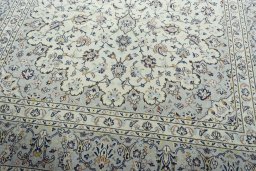 Close-up detail of 2000s Kashan rug from Iran / Persia showing Wool weave