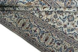 Close-up detail of 2000s Kashan rug from Iran / Persia showing Wool weave