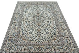 Surface texture of 2000s Kashan rug with natural Wool and intricate pattern