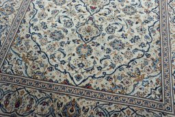 Close-up detail of 2000s Kashan rug from Iran / Persia showing Wool weave
