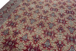 Backside of handmade 1950s Kashan rug showing knot structure and weave density