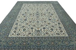 Surface texture of 2000s Kashan rug with natural Wool and intricate pattern