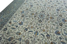 Backside of handmade 2000s Kashan rug showing knot structure and weave density