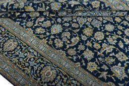 Surface texture of 2000s Kashan rug with natural Wool and intricate pattern