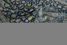 Backside of handmade 2000s Kashan rug showing knot structure and weave density