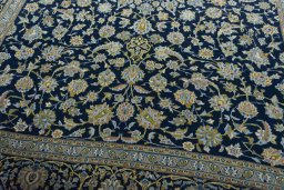 Close-up detail of 2000s Kashan rug from Iran / Persia showing Wool weave