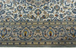 Corner detail of 2000s Kashan rug showing border pattern and Wool pile