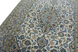 Backside of handmade 2000s Kashan rug showing knot structure and weave density