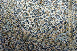 Close-up detail of 2000s Kashan rug from Iran / Persia showing Wool weave