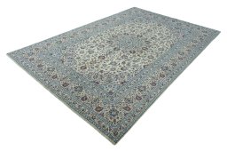 Corner detail of 2000s Kashan rug showing border pattern and Wool pile