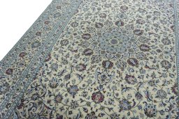 Backside of handmade 2000s Kashan rug showing knot structure and weave density