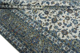 Close-up detail of 2000s Kashan rug from Iran / Persia showing Wool weave