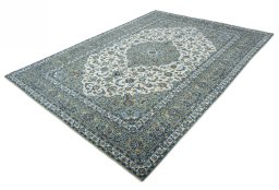 Corner detail of 2000s Kashan rug showing border pattern and Wool pile