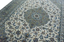 Backside of handmade 2000s Kashan rug showing knot structure and weave density