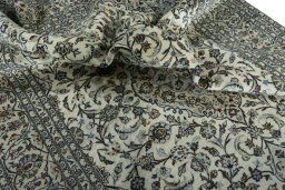 Surface texture of 2000s Kashan rug with natural Wool and intricate pattern