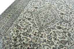 Backside of handmade 2000s Kashan rug showing knot structure and weave density