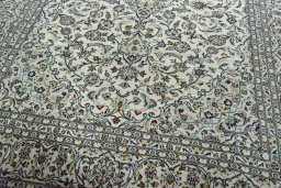 Close-up detail of 2000s Kashan rug from Iran / Persia showing Wool weave