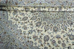 Close-up detail of 2000s Kashan rug from Iran / Persia showing Wool weave