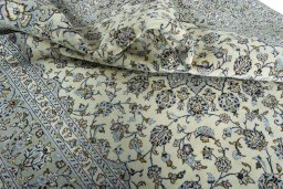 Surface texture of 2000s Kashan rug with natural Wool and intricate pattern