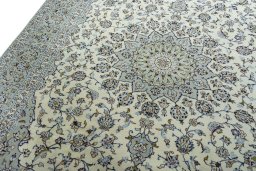 Backside of handmade 2000s Kashan rug showing knot structure and weave density