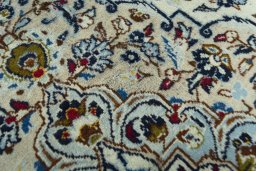 Close-up detail of 2000s Kashan rug from Iran / Persia showing Wool weave