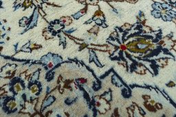 Surface texture of 2000s Kashan rug with natural Wool and intricate pattern
