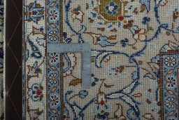 Close-up detail of 2000s Kashan rug from Iran / Persia showing Wool weave