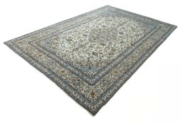 Corner detail of 2000s Kashan rug showing border pattern and Wool pile