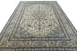 Surface texture of 2000s Kashan rug with natural Wool and intricate pattern