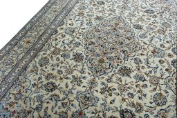 Backside of handmade 2000s Kashan rug showing knot structure and weave density